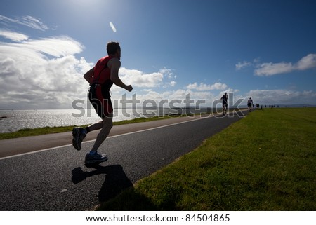GALWAY, IRELAND - SEPT 4: Unidentified athletes compete at first Edition of Galway Iron Man Triathlon on September 4, 2011 in Galway, Ireland