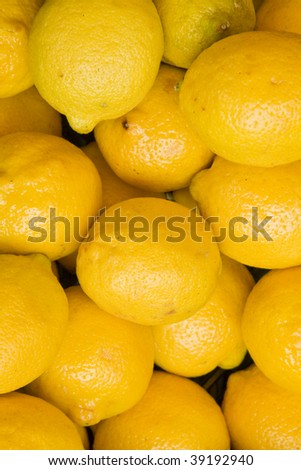 Lemons background. Closeup of a fresh lemons. Photo taken from the top.