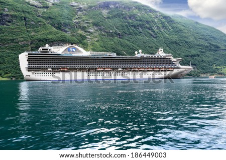 GEIRANGER, NORWAY - AUGUST 06, 2010: Scenic view of cruise ship Crown Princess, standing at anchor in Geiranger fjord