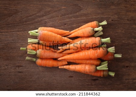 Carrot isolated in wood background