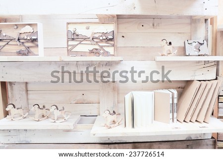 wood shelf with book and toys