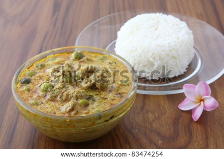 Thai food beef curry with rice in wood background