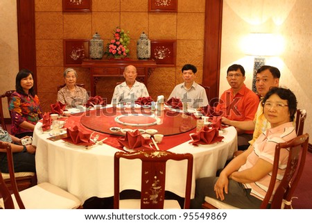 chinese family in dinner room