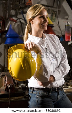 Female worker standing in office maintenance room