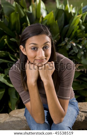 stock photo Pretty mixedrace Indian teen girl smiling at camera