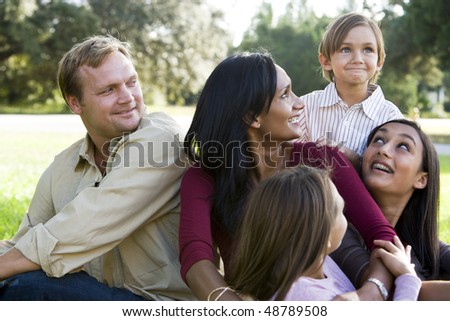 Indian mother surrounded by beautiful mixed race family