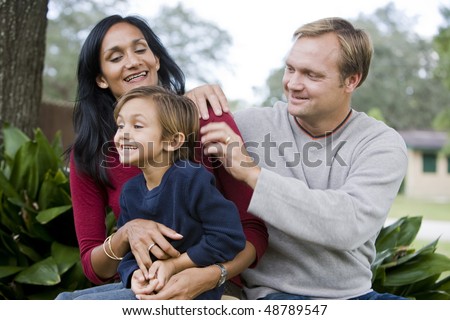 Indian mother and Caucasian father with cute mixed-race five year old son