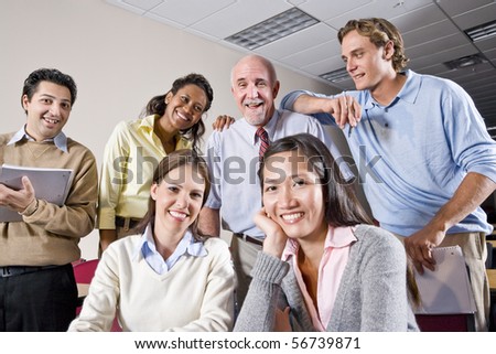 Multiracial group of college students and teacher in class