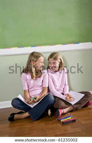 Back to school - two 8 year old girls doing homework together