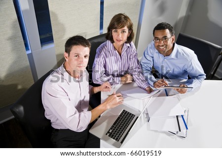 Workplace diversity - multiracial businesspeople working together in boardroom