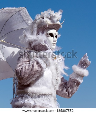 White person with umbrella at the 2014 venetian carnival of Annecy, France
