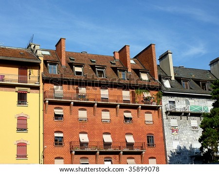Colored facades of old buildings by beautiful weather