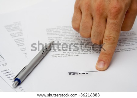 Hand showing signature place on contract