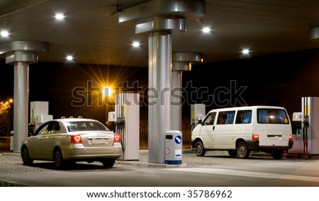 cars at the petrol station in night