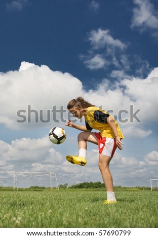 stock photo young girl playing football
