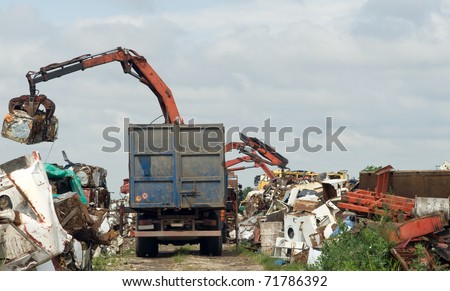 scrap metal scrap-iron junk outdoor with crane