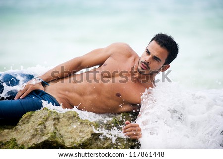 Portrait of an attractive young model on a wave
