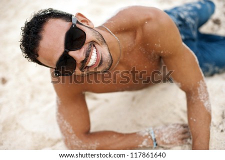 Portrait of an attractive young model on a tropical beach