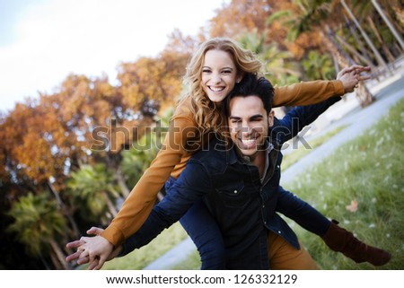 Young couple in the countryside in autumn.
