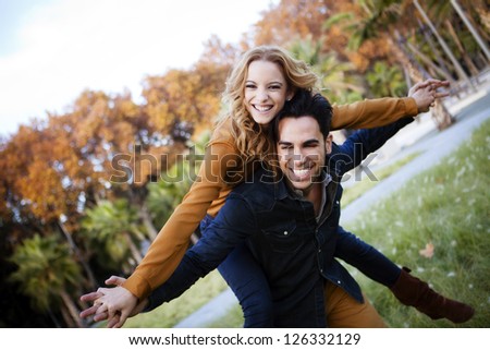 Young couple in the countryside in autumn Young couple in the countryside in autumn