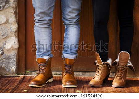 Boy and girl with fashion leather boots