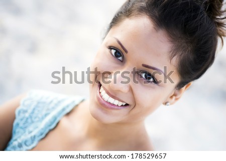 Beautiful latin woman staring at the camera
