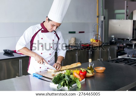 Young latin chef in the kitchen