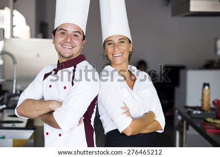 Two latin chefs in a cooking school