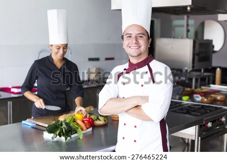 Two latin chefs in a cooking school