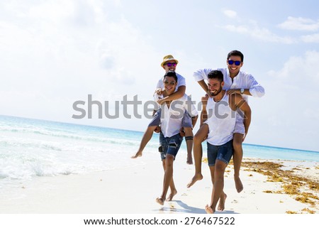 Four male friends at the beach