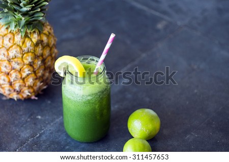 Homemade green detox juice, with pineapple and lime