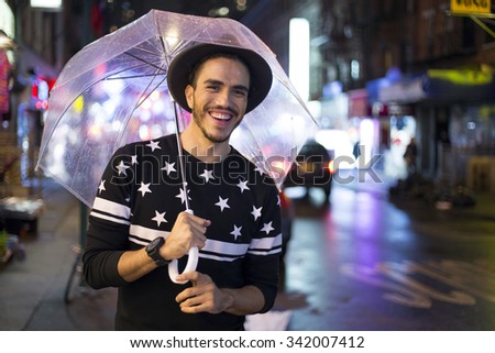 Traveler exploring the city on a rainy night. Chinatown, New York
