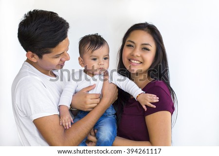 Young latin couple with a six month baby