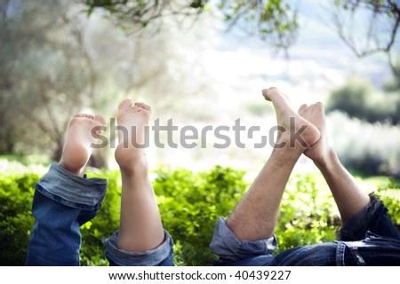 Feet up of a young  couple in love expressing relaxation and fun