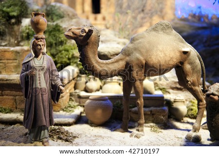 Crib scene with woman and camel.