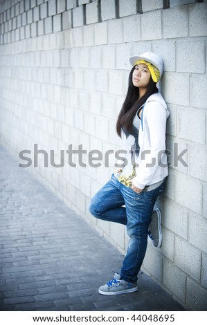     -  4 Stock-photo-beautiful-asian-girl-in-hip-hop-style-standing-in-block-wall-44048695