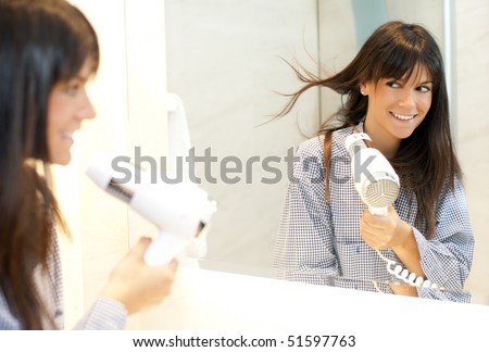 looking in mirror. woman looking in mirror