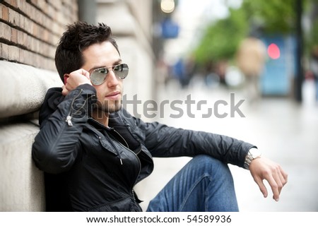 Young handsome man speaking on the phone