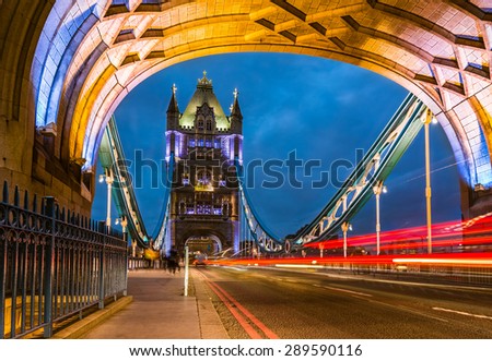 Bridge Tower night view from the bridge, London United Kingdom. A combined bascule and suspension bridge which crosses the River Thames and has become an iconic symbol of London.