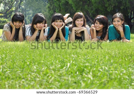 Smiling Happy group of girl friends in the park