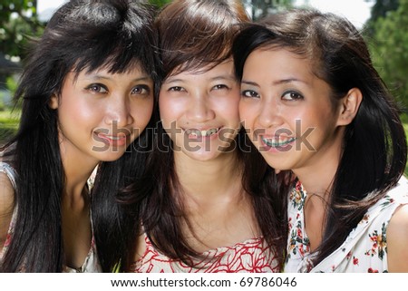close up portrait of three girl friend with lovely smiling