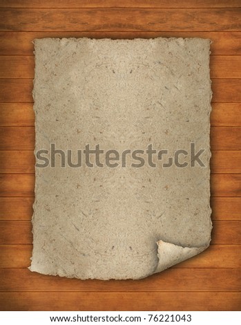 Old paper with corner curl on the wood background