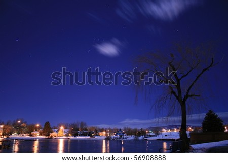 A small lake at a local park in Denver metro area of Colorado on a moon lit night
