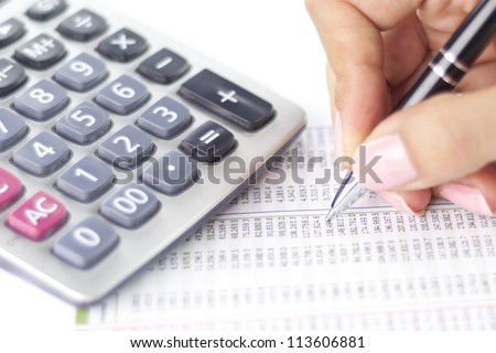 Businesswoman balancing the accounts