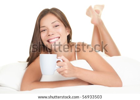 Woman enjoying tea in the bed