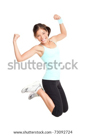 Fitness woman jumping excited isolated on white background Full body image of beautiful multiracial Asian Caucasian female model in jump flexing and showing muscles Fitness woman jumping excited isolated on white background Full body image of beautiful multiracial Asian Caucasian female model in jump flexing and showing muscles