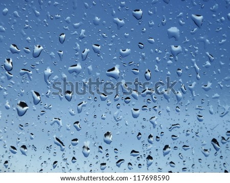 spots of rain on the window glass