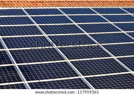 Photovoltaic energy. Solar panels on a house\'s roof.