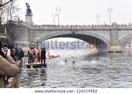 TURIN - JANUARY 27: The challenge plunge of the people named polar bears into the cold winter waters of river Po, a traditional annual event that starts the new year, on January 27, 2013 Turin, Italy.
