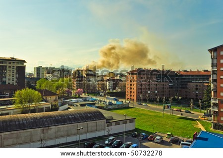 TURIN - APRIL 2: Coloumn of smoke caused by fire of a senior social centre in Pozzo Strada neighborhood. April 2, 2010 in Turin, Italy.